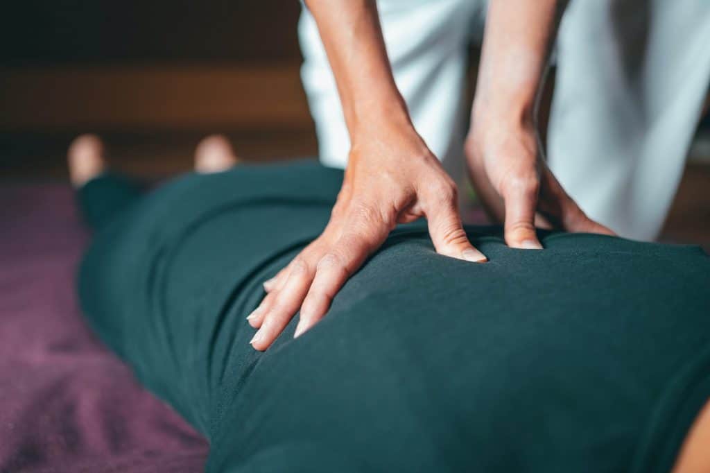 close up image of a person giving a massage