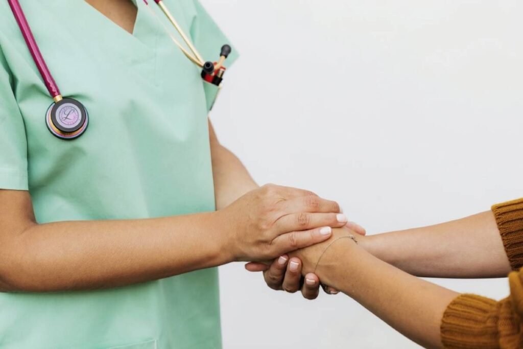 Nurse comforting patient